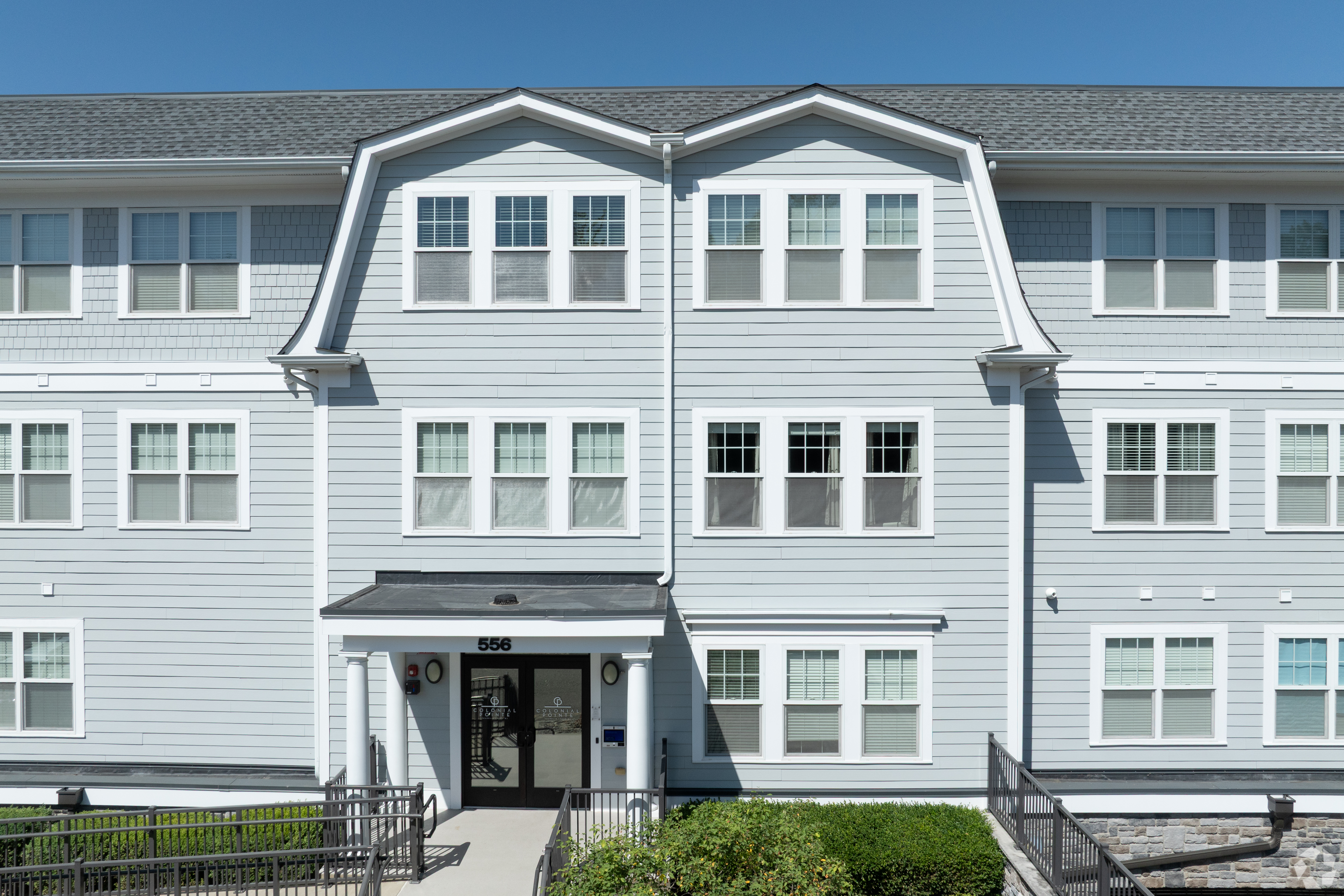 556 main entrance with branded Colonial Pointe doors