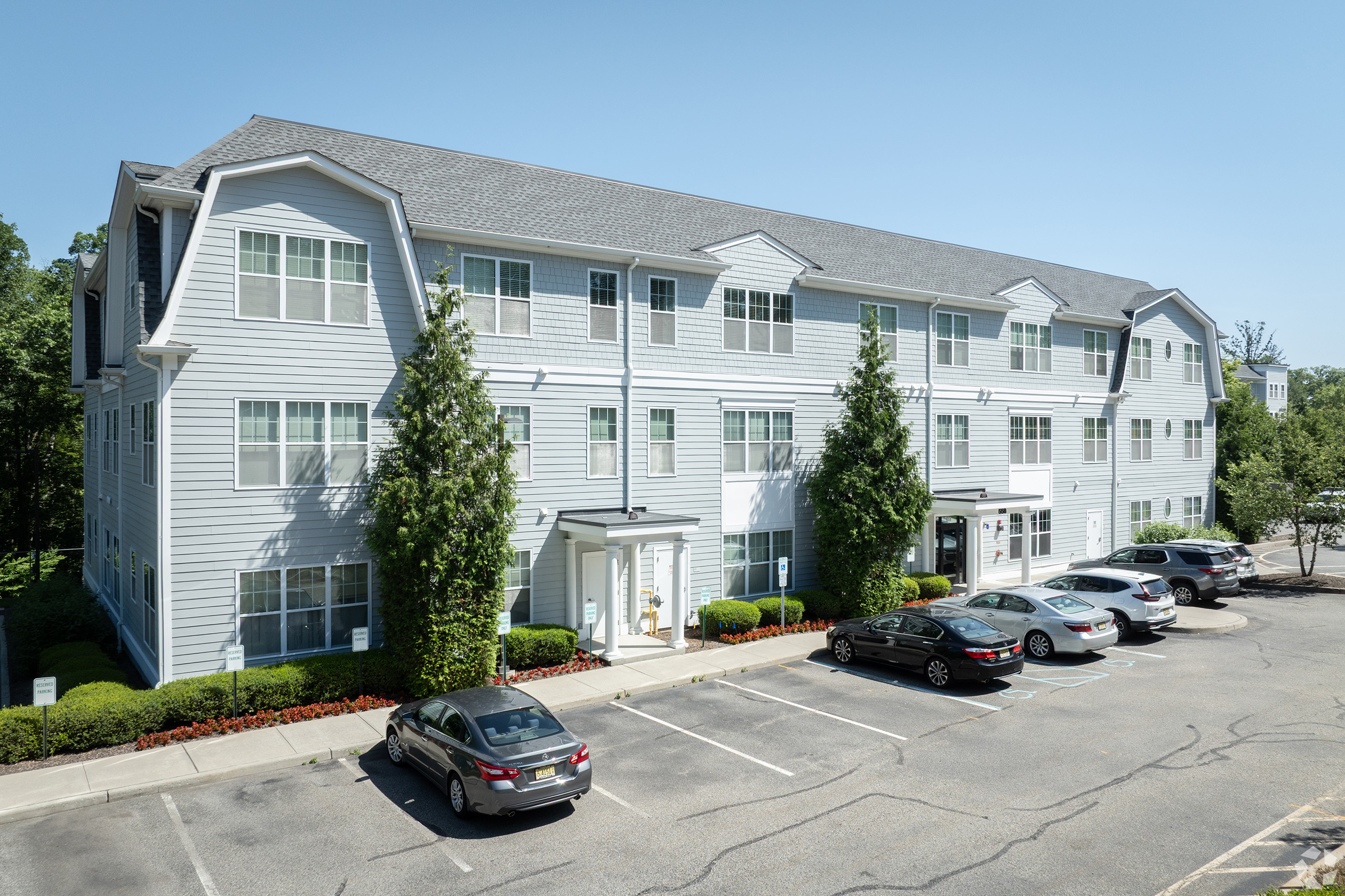 Front exterior of the 558 building with reserved parking