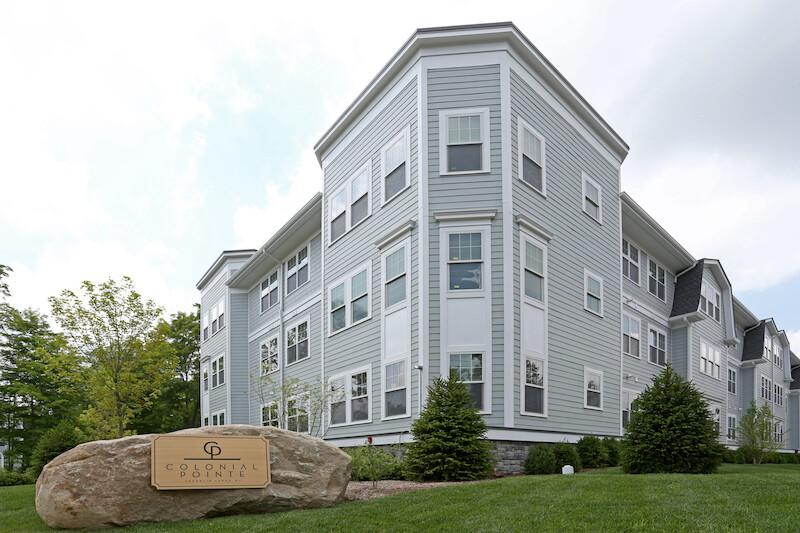 Luxury Plus building exterior with monument sign